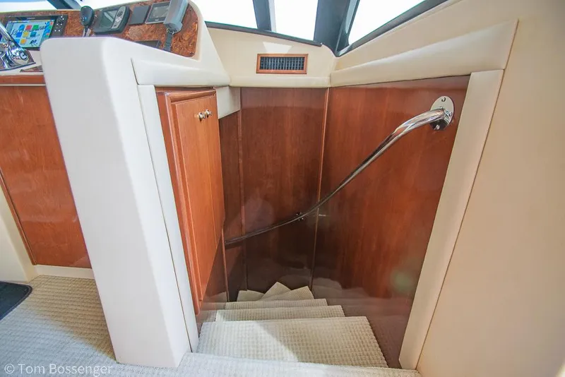 Slide: The Image of Staircase inside 2008 Meridian 580 Pilothouse yacht with wooden paneling and handrail. - 40