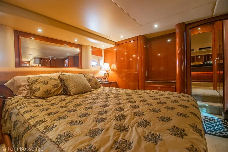 Slide: The Image of Luxurious bedroom interior of 2008 Meridian 580 Pilothouse yacht with elegant wood finishes. - 42