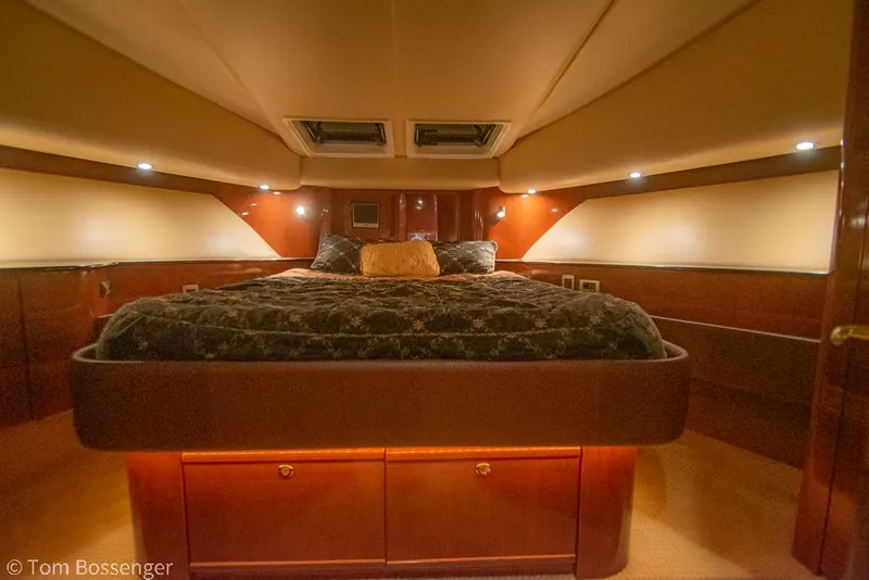 Slide: The Image of Luxurious bedroom interior of 2008 Meridian 580 Pilothouse yacht, featuring elegant wood finishes. - 49