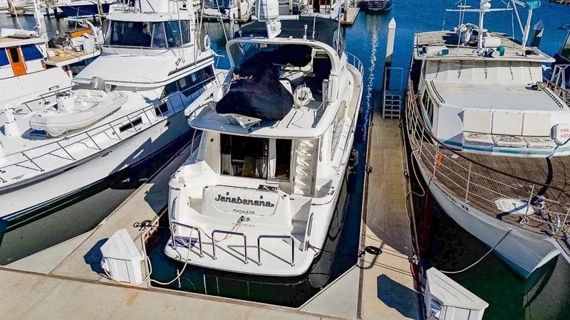Slide: The Image of 2008 Meridian 580 Pilothouse yacht docked at marina, surrounded by other boats. - 6