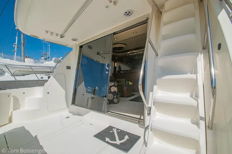 Slide: The Image of 2008 Meridian 580 Pilothouse yacht interior with stairs and glass doors. - 9