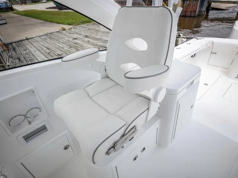 Slide: The Image of 2025 Albemarle 30 Express boat with luxurious white captain's chair. - 2