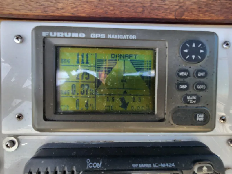 Slide: The Image of Furuno GPS navigator on 1988 Chris-Craft 315 Commander boat dashboard. - 10