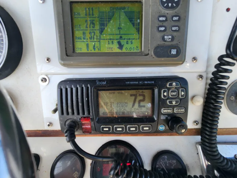 Slide: The Image of Close-up of 1988 Chris-Craft 315 Commander dashboard with navigation and communication equipment. - 11