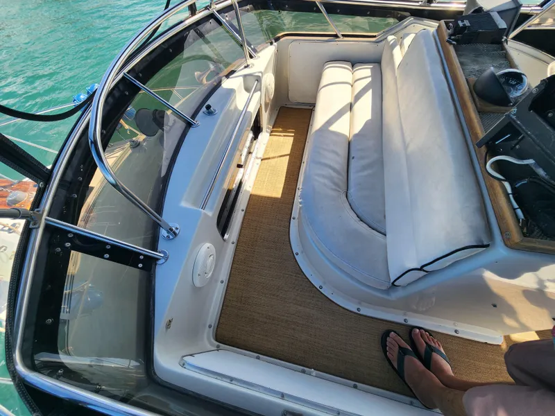 Slide: The Image of 1988 Chris-Craft 315 Commander boat interior with seating and carpeted floor. - 14