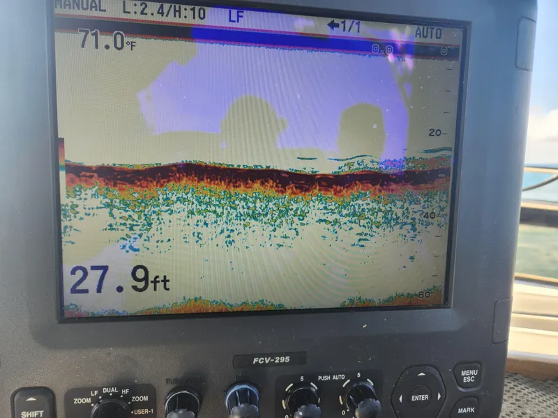 Slide: The Image of Fish finder display on 1988 Chris-Craft 315 Commander, showing water depth and temperature. - 19