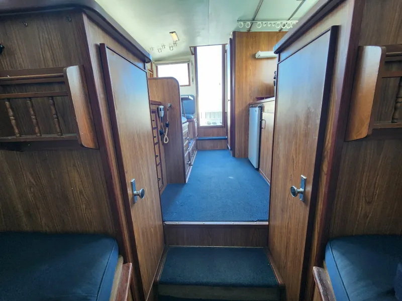 Slide: The Image of Interior of 1988 Chris-Craft 315 Commander with wood paneling and blue carpet. - 39