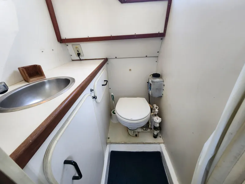 Slide: The Image of 1988 Chris-Craft 315 Commander boat bathroom with sink and toilet. - 41