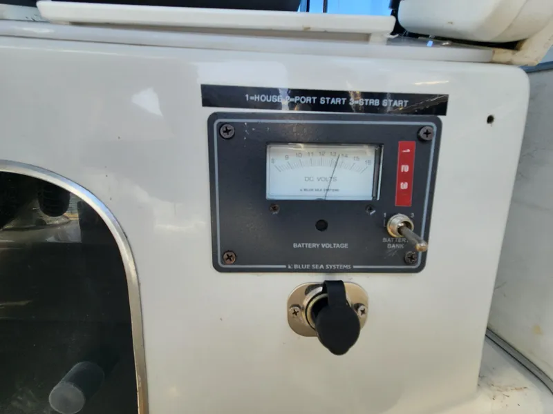 Slide: The Image of Control panel of 1988 Chris-Craft 315 Commander boat, featuring battery voltage gauge. - 9