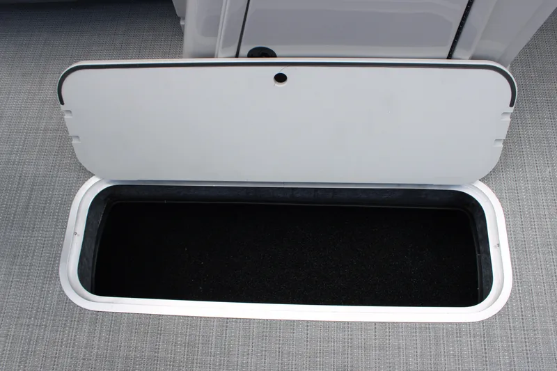 Slide: The Image of Open storage compartment on 2025 Starcraft EXS 3 Q DH boat. - 12