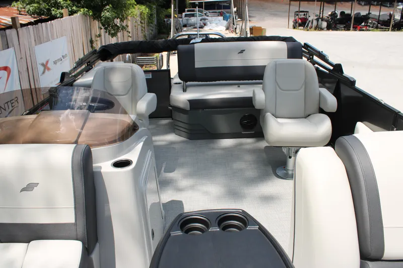 Slide: The Image of 2025 Starcraft EXS 3 Q DH boat interior with plush seating and modern design. - 4