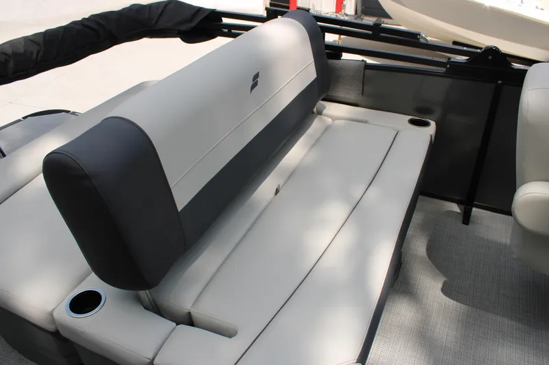 Slide: The Image of 2025 Starcraft EXS 3 Q DH boat interior with gray seating and cup holders. - 7