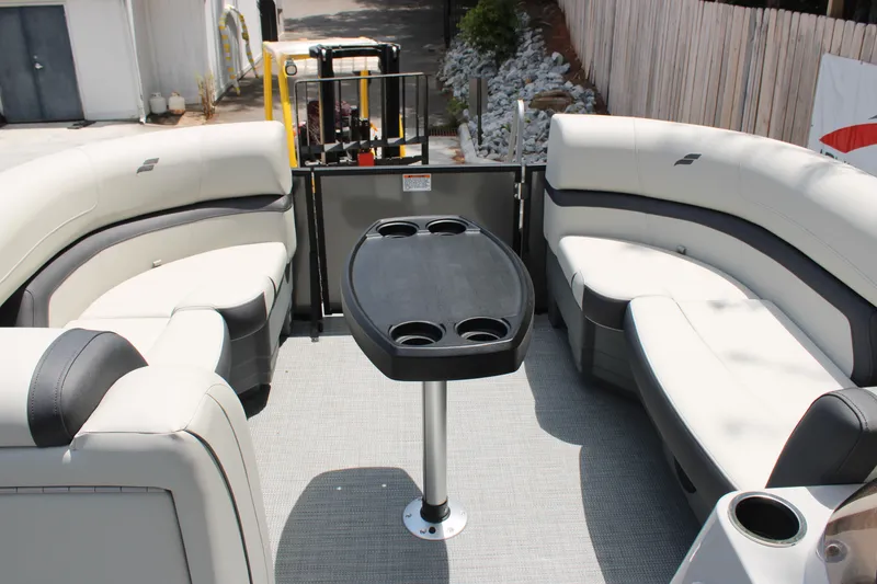 Slide: The Image of 2025 Starcraft EXS 3 Q DH boat interior with seating and table. - 9