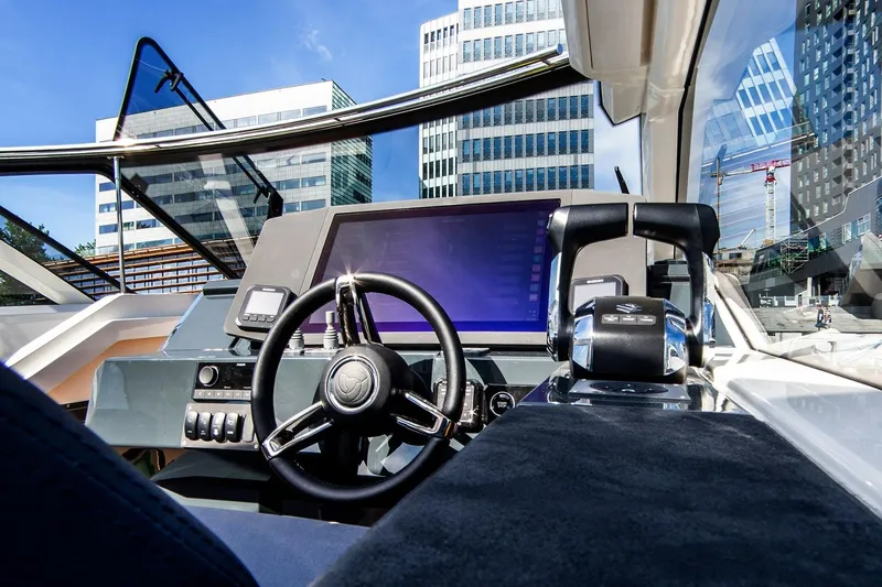 Slide: The Image of 2024 Parker Poland Sorrento 100 yacht cockpit with modern steering and navigation controls. - 24