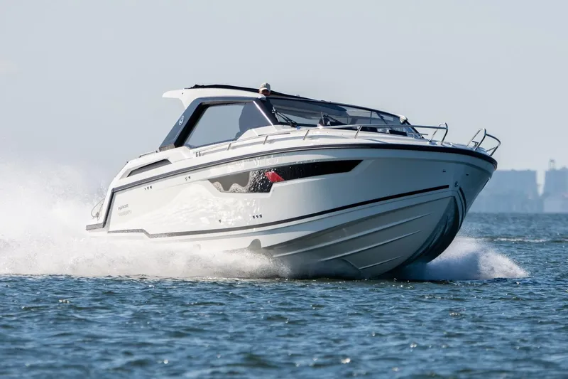 Slide: The Image of 2024 Parker Poland Sorrento 100 speedboat cruising on open water. - 3