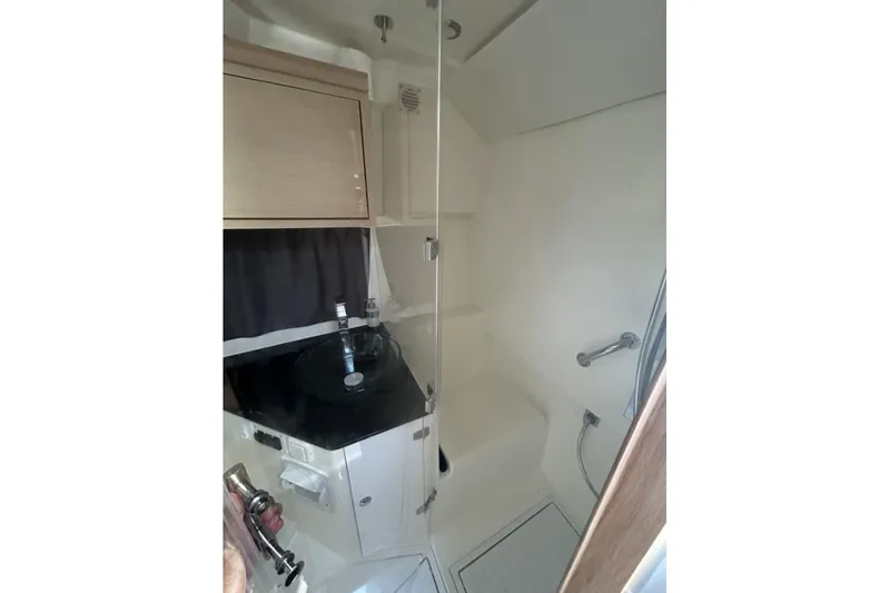 Slide: The Image of 2025 Parker Poland Sorrento 100 boat bathroom with modern fixtures and compact design. - 37