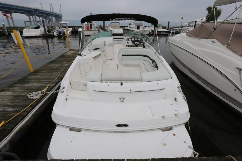 Slide: The Image of 2002 Chaparral 280 SSi boat docked at marina, rear view. - 1