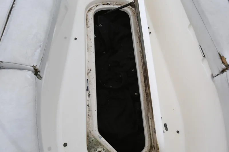 Slide: The Image of Open storage compartment on 2002 Chaparral 280 SSi boat, showing interior details. - 30