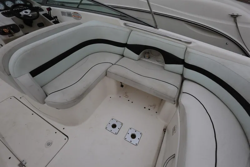 Slide: The Image of 2002 Chaparral 280 SSi boat interior with white seating and black accents. - 35