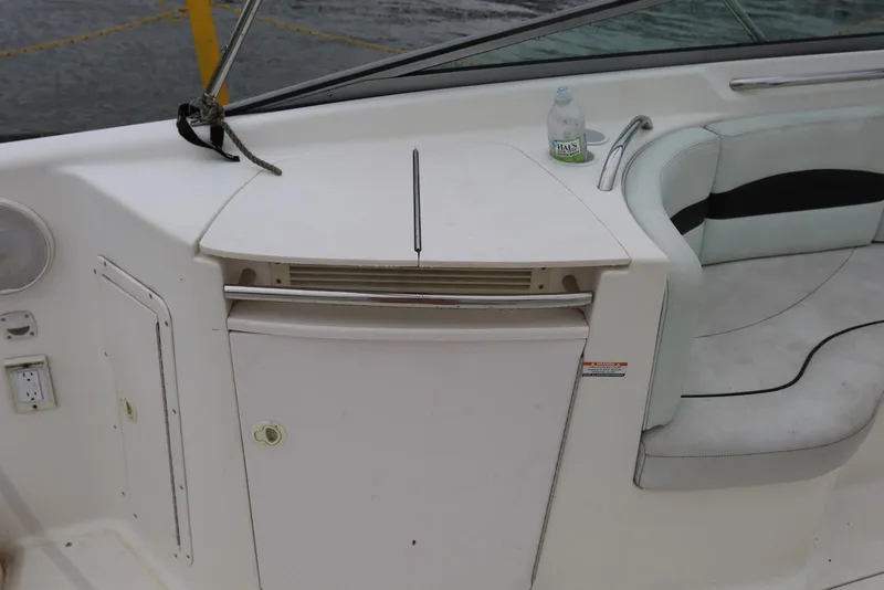 Slide: The Image of 2002 Chaparral 280 SSi boat interior with seating and a small counter area. - 39