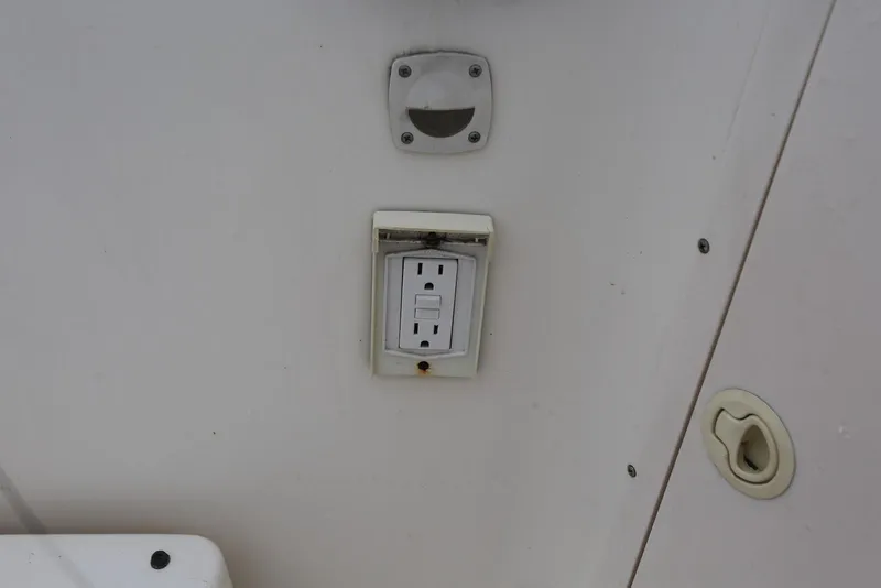Slide: The Image of Electrical outlet on 2002 Chaparral 280 SSi boat interior wall. - 44