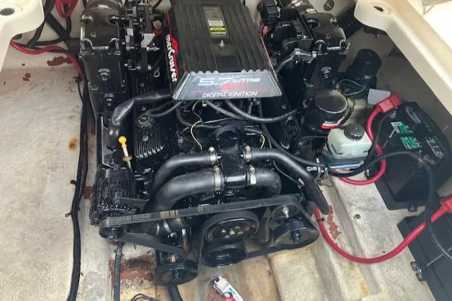 Slide: The Image of Engine of a 2001 Sea Ray 245 Weekender boat, showcasing detailed components and wiring. - 7