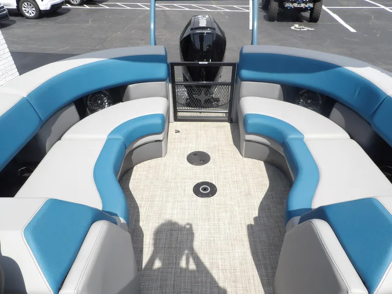 Slide: The Image of 2023 Berkshire 23RFX STS pontoon boat interior with blue and gray seating. - 2