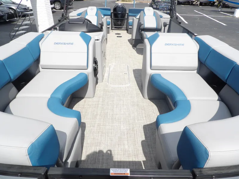 Slide: The Image of 2023 Berkshire 23RFX STS pontoon boat interior with blue and gray seating. - 6