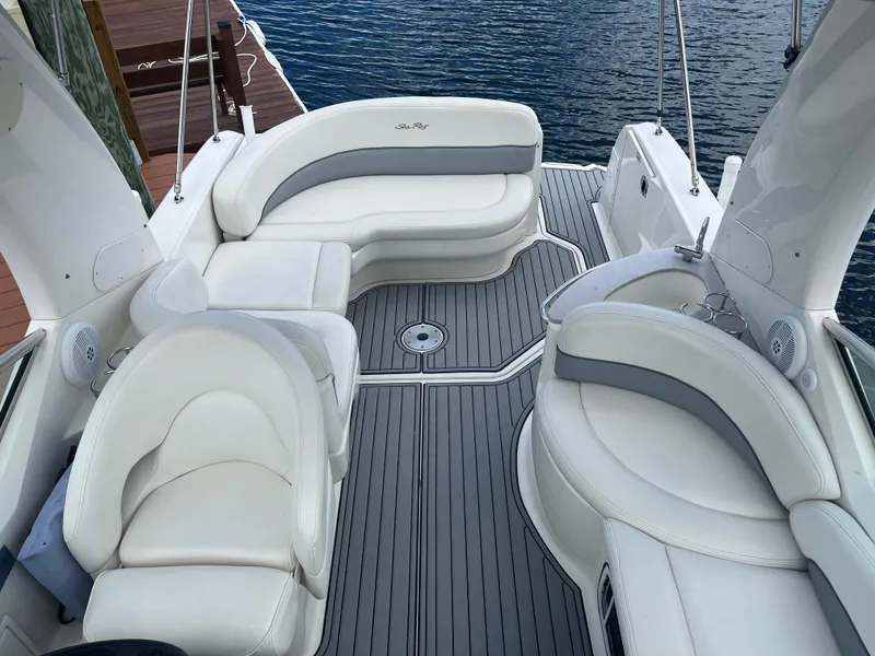 Slide: The Image of Interior of a 2005 Sea Ray Sundancer 260 yacht with white seating. - 11
