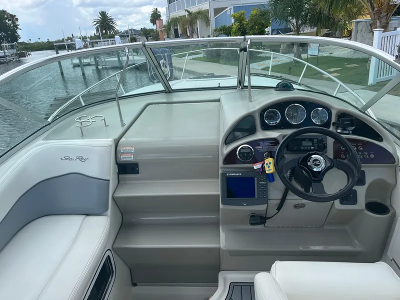 Slide: The Image of Cockpit of 2005 Sea Ray Sundancer 260 with steering wheel and instruments. - 12