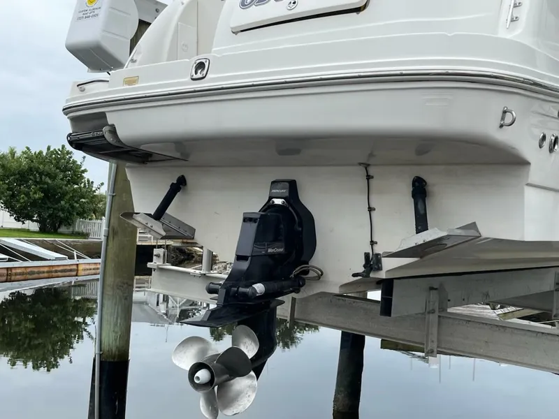 Slide: The Image of Rear view of a 2005 Sea Ray Sundancer 260 boat at dock. - 9