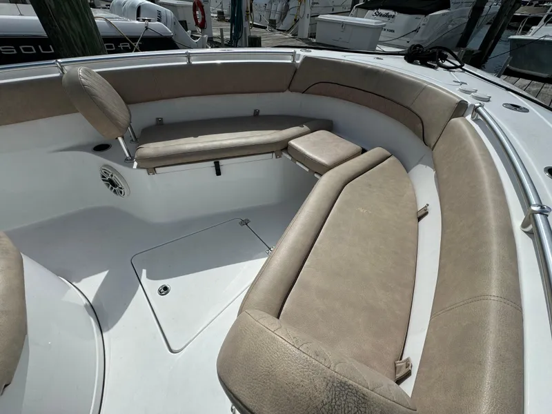 Slide: The Image of 2020 Sportsman Open 252 Center Console boat with tan cushioned seating. - 26