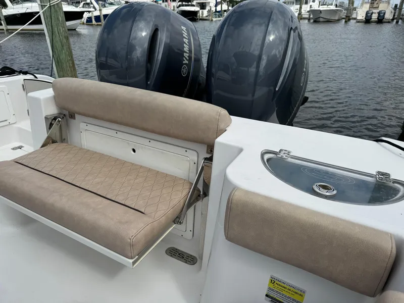 Slide: The Image of 2020 Sportsman Open 252 Center Console boat with Yamaha engines, featuring comfortable seating and livewell. - 33