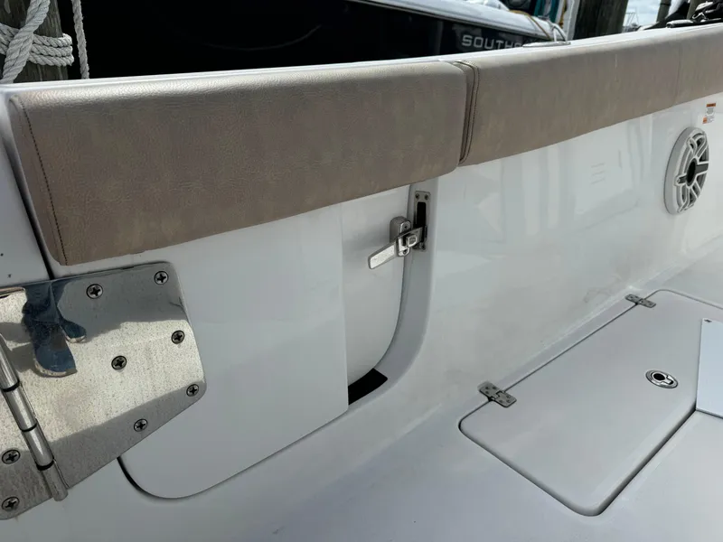 Slide: The Image of 2020 Sportsman Open 252 Center Console boat interior, featuring seating and storage compartments. - 38