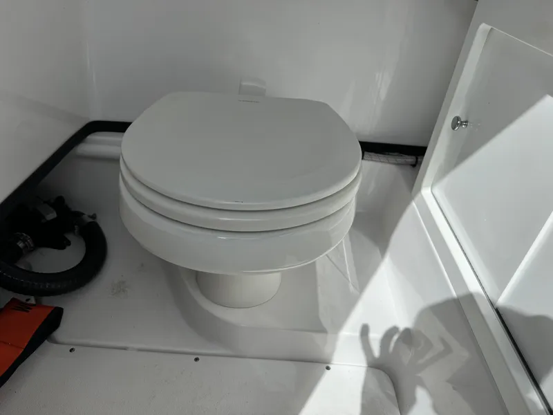 Slide: The Image of 2020 Sportsman Open 252 Center Console boat toilet interior. - 39