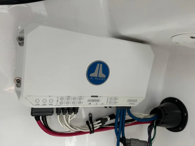 Slide: The Image of JL Audio amplifier installed on a 2020 Sportsman Open 252 Center Console boat. - 40