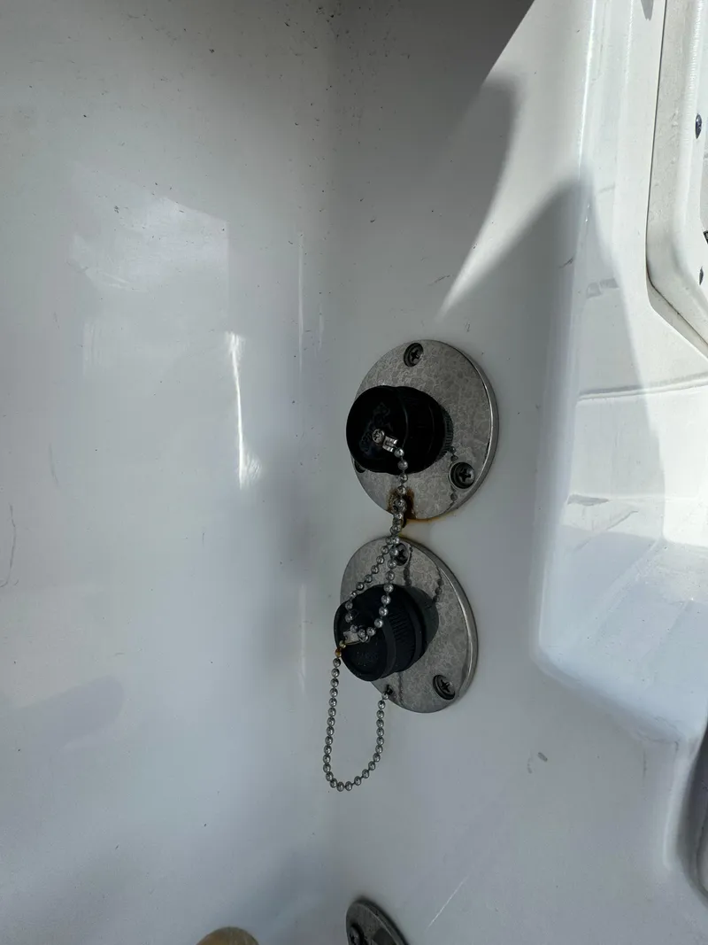 Slide: The Image of Fuel caps on a 2020 Sportsman Open 252 Center Console boat. - 43