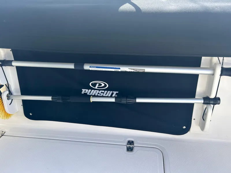 Slide: The Image of 2016 Pursuit S 280 Sport boat interior with rod holder and logo. - 15