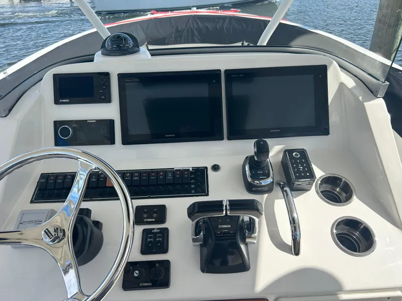 Slide: The Image of 2016 Pursuit S 280 Sport boat dashboard with modern navigation controls. - 22