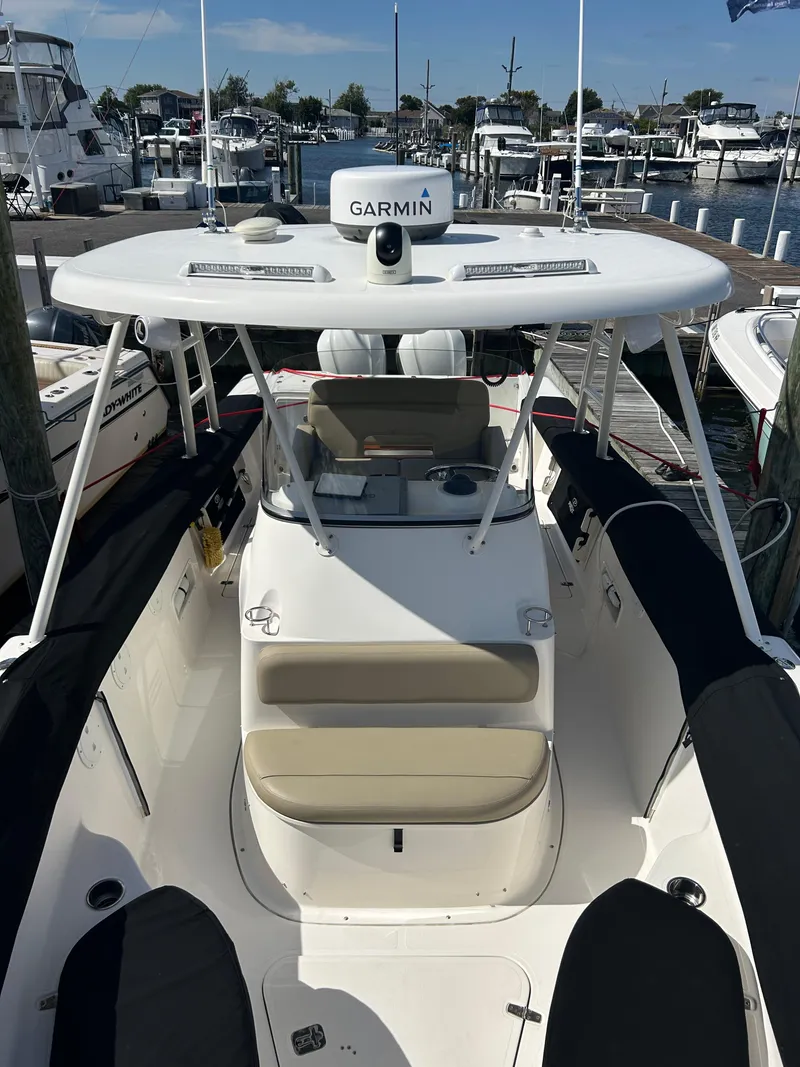 Slide: The Image of 2016 Pursuit S 280 Sport boat docked at marina with Garmin equipment. - 31