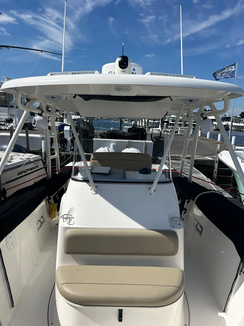 Slide: The Image of 2016 Pursuit S 280 Sport boat docked under clear blue sky. - 32