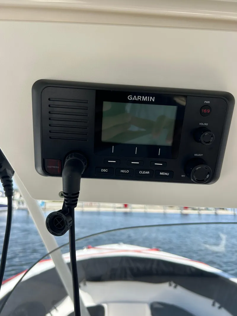 Slide: The Image of Garmin marine radio on 2016 Pursuit S 280 Sport boat dashboard. - 34