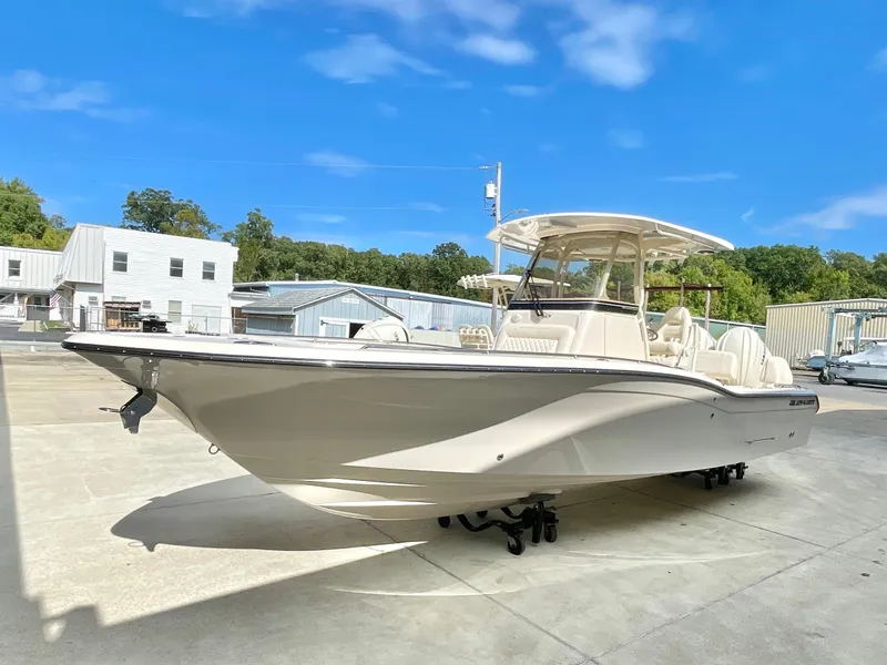 Slide: The Image of 2025 Grady-White 281 Coastal Explorer boat in a sunny outdoor setting. - 1