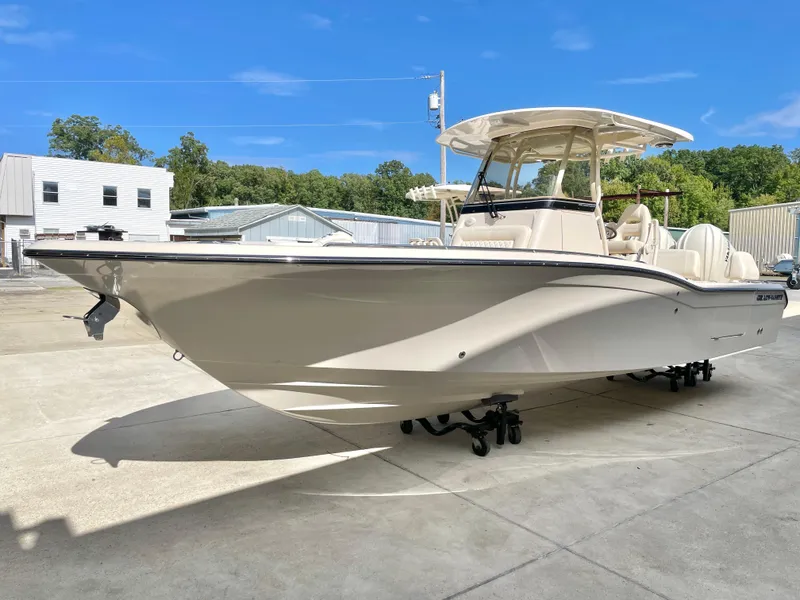 Slide: The Image of 2025 Grady-White 281 Coastal Explorer boat on display outdoors. - 2