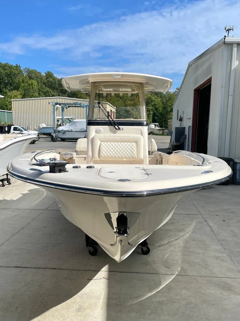 Slide: The Image of 2025 Grady-White 281 Coastal Explorer boat docked outdoors. - 5