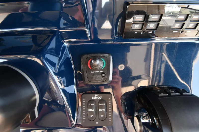 Slide: The Image of Control panel of 2019 Pursuit S 408 Sport boat with switches and controls. - 16
