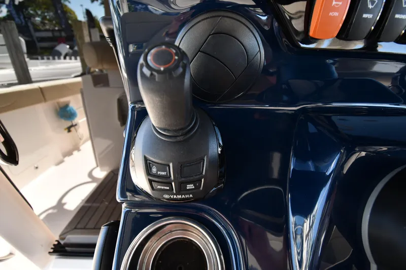 Slide: The Image of Joystick control on 2019 Pursuit S 408 Sport boat dashboard. - 17