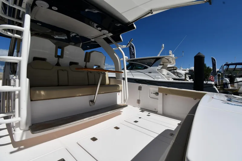 Slide: The Image of 2019 Pursuit S 408 Sport boat interior with seating and open deck. - 20
