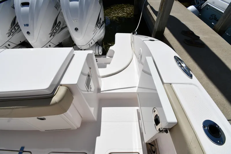 Slide: The Image of 2019 Pursuit S 408 Sport boat deck with twin outboard engines. - 26