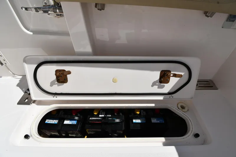 Slide: The Image of Battery compartment of a 2019 Pursuit S 408 Sport boat, showing multiple batteries. - 31